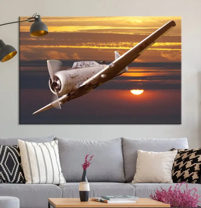 The Avi Wall Art Airplane on Sunset Canvas Print showcases a vintage airplane soaring at sunset across three panels. Crafted on museum-quality canvases with UV-protective coating, it is designed to preserve its timeless beauty.