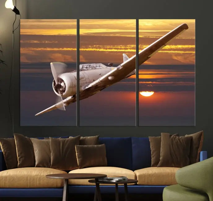 The Avi Wall Art Airplane on Sunset Canvas Print showcases a vintage airplane soaring at sunset across three panels. Crafted on museum-quality canvases with UV-protective coating, it is designed to preserve its timeless beauty.