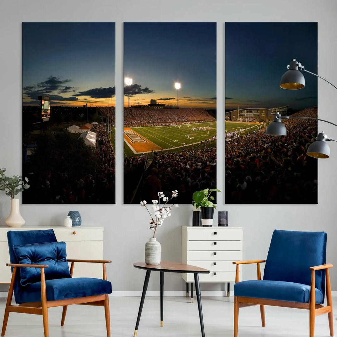 Experience the vibrant energy of game day with the Ball State Cardinals Football Team Print - Muncie Scheumann Stadium Wall Art Canvas Print. This stunning artwork captures a sunset-lit football stadium, alive with a match in progress and spectators filling the stands under floodlights, all rendered on museum-quality canvas.