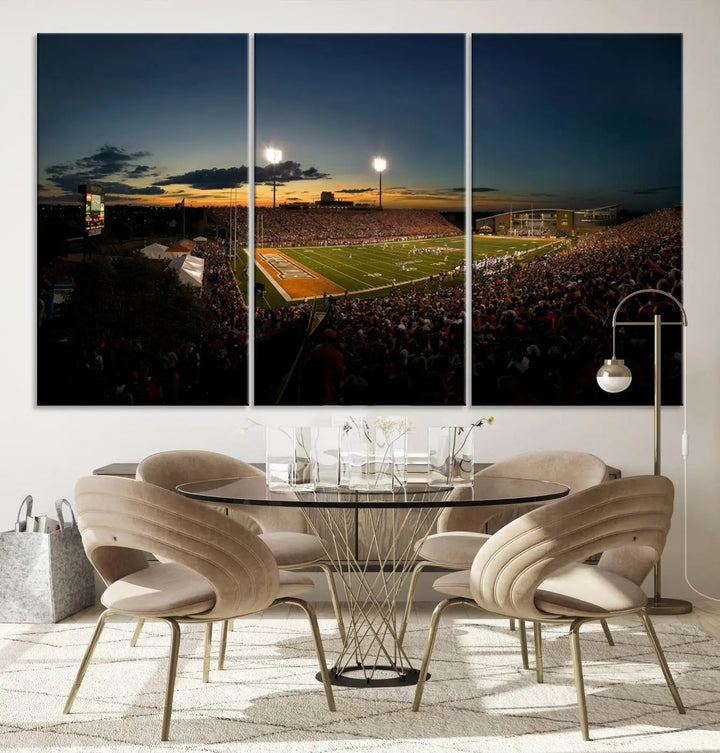 Experience the vibrant energy of game day with the Ball State Cardinals Football Team Print - Muncie Scheumann Stadium Wall Art Canvas Print. This stunning artwork captures a sunset-lit football stadium, alive with a match in progress and spectators filling the stands under floodlights, all rendered on museum-quality canvas.