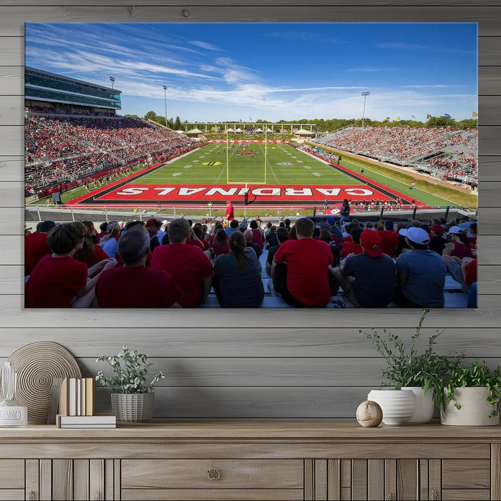 Experience a gallery-quality finish with the Ball State Cardinals Football Team Print - Muncie Scheumann Stadium Wall Art Canvas Print. This piece features a three-panel depiction of the stadium and its lively crowd from the stands, adding a dynamic touch to any modern living room setting.