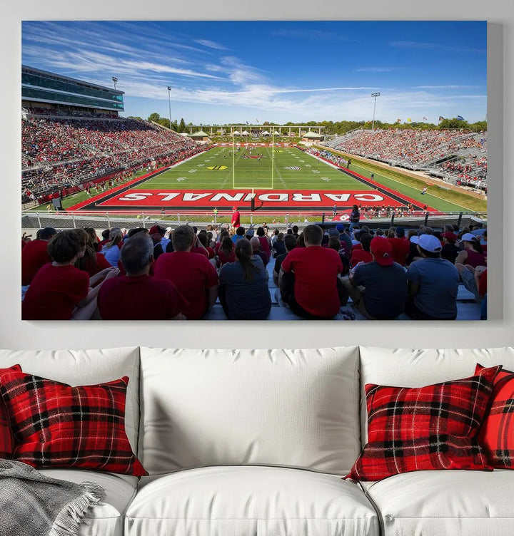 Experience a gallery-quality finish with the Ball State Cardinals Football Team Print - Muncie Scheumann Stadium Wall Art Canvas Print. This piece features a three-panel depiction of the stadium and its lively crowd from the stands, adding a dynamic touch to any modern living room setting.