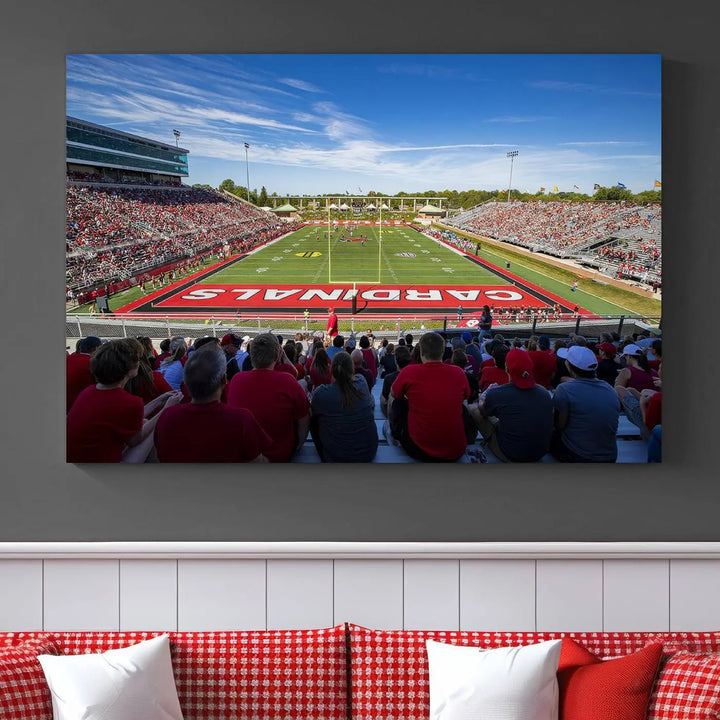 Experience a gallery-quality finish with the Ball State Cardinals Football Team Print - Muncie Scheumann Stadium Wall Art Canvas Print. This piece features a three-panel depiction of the stadium and its lively crowd from the stands, adding a dynamic touch to any modern living room setting.