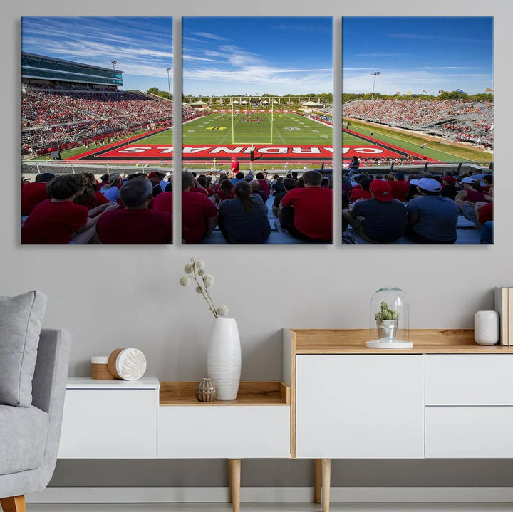 Experience a gallery-quality finish with the Ball State Cardinals Football Team Print - Muncie Scheumann Stadium Wall Art Canvas Print. This piece features a three-panel depiction of the stadium and its lively crowd from the stands, adding a dynamic touch to any modern living room setting.