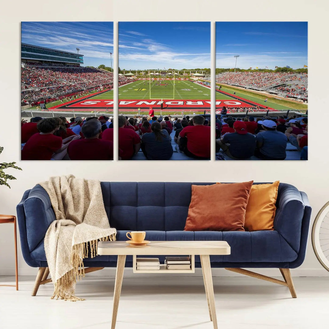 Experience a gallery-quality finish with the Ball State Cardinals Football Team Print - Muncie Scheumann Stadium Wall Art Canvas Print. This piece features a three-panel depiction of the stadium and its lively crowd from the stands, adding a dynamic touch to any modern living room setting.