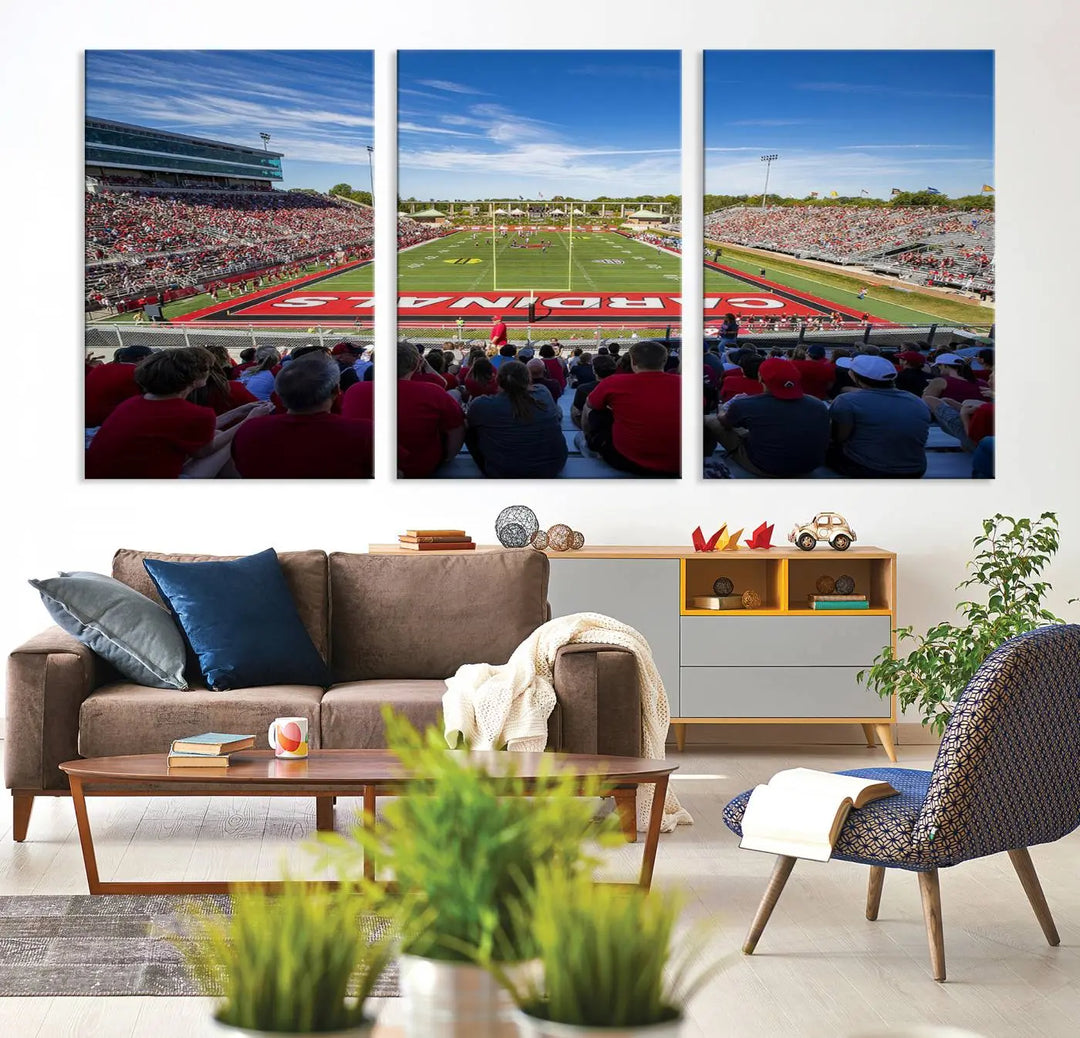 Experience a gallery-quality finish with the Ball State Cardinals Football Team Print - Muncie Scheumann Stadium Wall Art Canvas Print. This piece features a three-panel depiction of the stadium and its lively crowd from the stands, adding a dynamic touch to any modern living room setting.