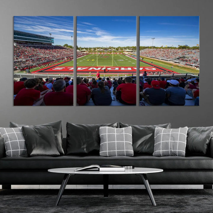 Experience a gallery-quality finish with the Ball State Cardinals Football Team Print - Muncie Scheumann Stadium Wall Art Canvas Print. This piece features a three-panel depiction of the stadium and its lively crowd from the stands, adding a dynamic touch to any modern living room setting.