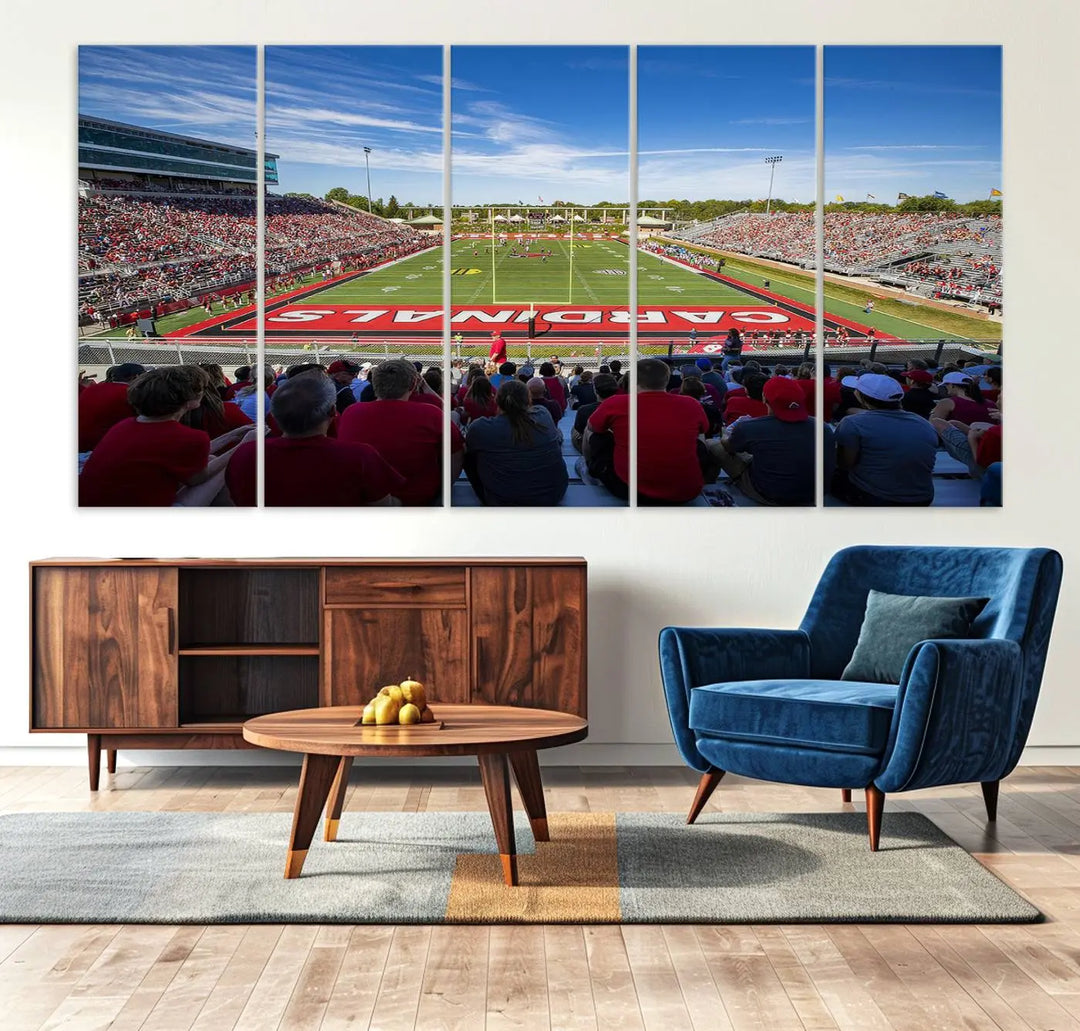 Experience a gallery-quality finish with the Ball State Cardinals Football Team Print - Muncie Scheumann Stadium Wall Art Canvas Print. This piece features a three-panel depiction of the stadium and its lively crowd from the stands, adding a dynamic touch to any modern living room setting.