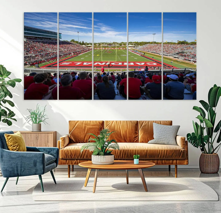 Experience a gallery-quality finish with the Ball State Cardinals Football Team Print - Muncie Scheumann Stadium Wall Art Canvas Print. This piece features a three-panel depiction of the stadium and its lively crowd from the stands, adding a dynamic touch to any modern living room setting.