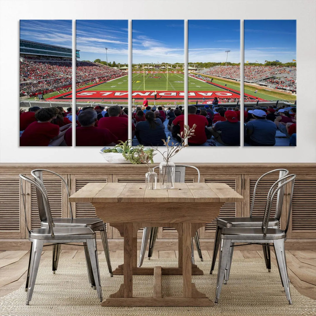 Experience a gallery-quality finish with the Ball State Cardinals Football Team Print - Muncie Scheumann Stadium Wall Art Canvas Print. This piece features a three-panel depiction of the stadium and its lively crowd from the stands, adding a dynamic touch to any modern living room setting.