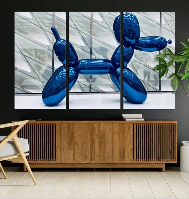 The Balloon Dog Wall Art Canvas Print features a triptych of a shiny blue balloon dog sculpture. This museum-quality artwork showcases gallery-wrapped edges and includes a UV-protective coating to ensure long-lasting brilliance.