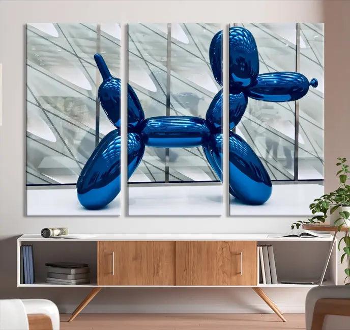 The Balloon Dog Wall Art Canvas Print features a triptych of a shiny blue balloon dog sculpture. This museum-quality artwork showcases gallery-wrapped edges and includes a UV-protective coating to ensure long-lasting brilliance.