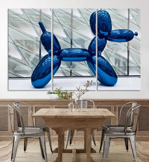 The Balloon Dog Wall Art Canvas Print features a triptych of a shiny blue balloon dog sculpture. This museum-quality artwork showcases gallery-wrapped edges and includes a UV-protective coating to ensure long-lasting brilliance.