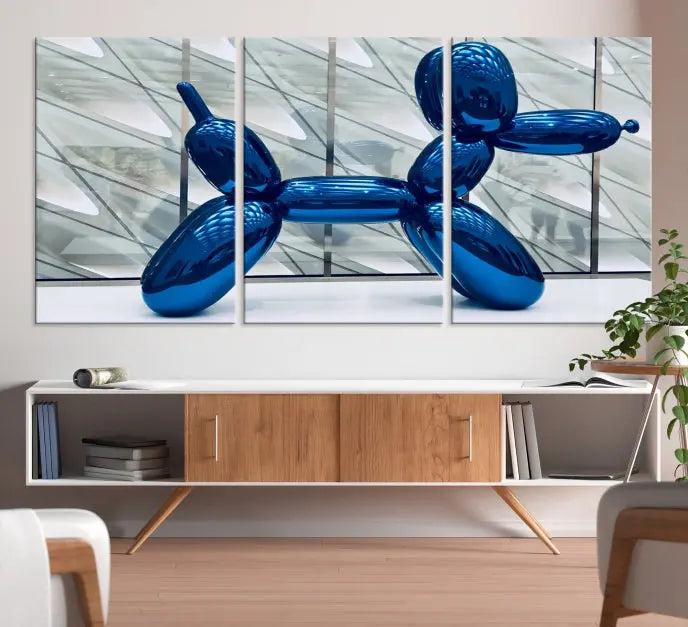 The Balloon Dog Wall Art Canvas Print features a triptych of a shiny blue balloon dog sculpture. This museum-quality artwork showcases gallery-wrapped edges and includes a UV-protective coating to ensure long-lasting brilliance.