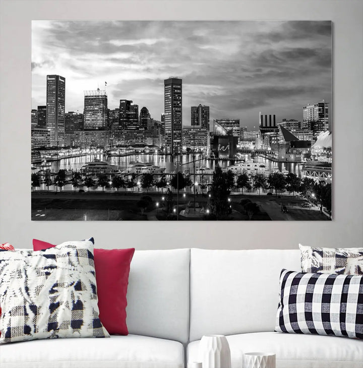 The "Baltimore City Cloudy Skyline Black and White Wall Art Canvas Print," crafted on museum-quality canvases with a UV-protective coating, elegantly adorns the dark wall. Ready to hang, it adds an elegant touch to any room.