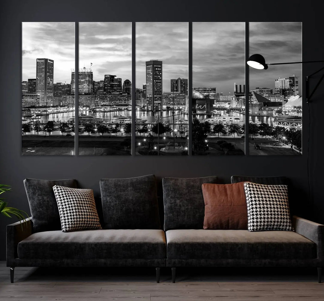 The "Baltimore City Cloudy Skyline Black and White Wall Art Canvas Print," crafted on museum-quality canvases with a UV-protective coating, elegantly adorns the dark wall. Ready to hang, it adds an elegant touch to any room.