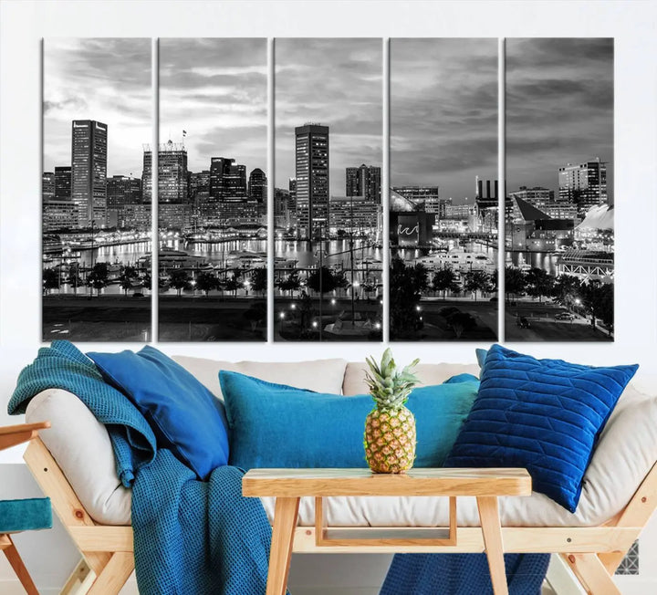 The "Baltimore City Cloudy Skyline Black and White Wall Art Canvas Print," crafted on museum-quality canvases with a UV-protective coating, elegantly adorns the dark wall. Ready to hang, it adds an elegant touch to any room.