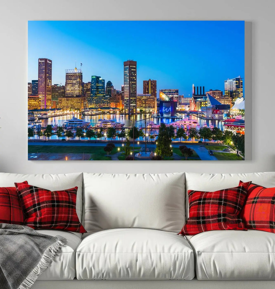 The Baltimore City Lights Blue Skyline Cityscape View Wall Art Canvas Print, a three-panel depiction of a city skyline at dusk on museum-quality canvas, adorns the area, showcasing an elegant evening cityscape.