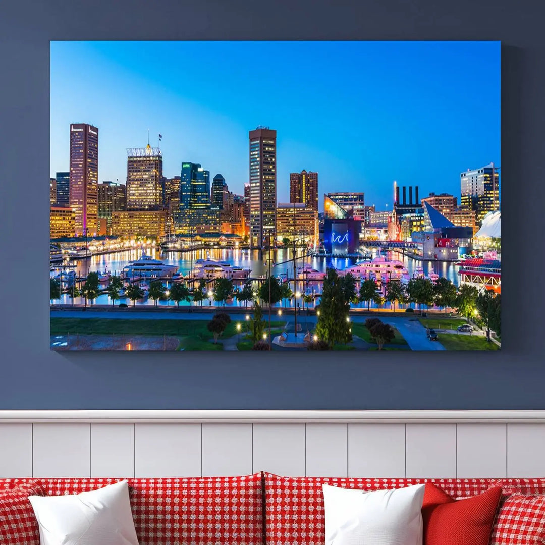 The Baltimore City Lights Blue Skyline Cityscape View Wall Art Canvas Print, a three-panel depiction of a city skyline at dusk on museum-quality canvas, adorns the area, showcasing an elegant evening cityscape.