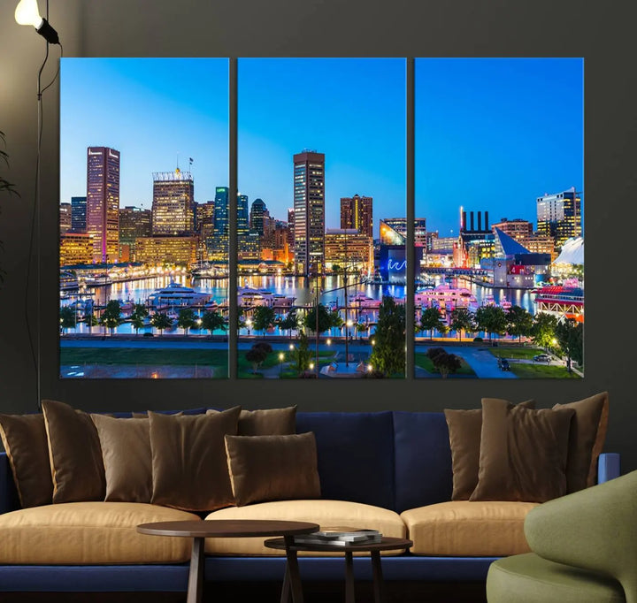 The Baltimore City Lights Blue Skyline Cityscape View Wall Art Canvas Print, a three-panel depiction of a city skyline at dusk on museum-quality canvas, adorns the area, showcasing an elegant evening cityscape.