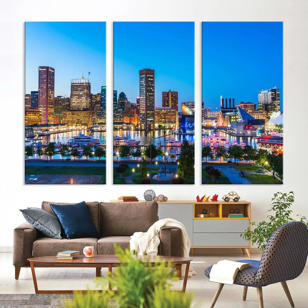 The Baltimore City Lights Blue Skyline Cityscape View Wall Art Canvas Print, a three-panel depiction of a city skyline at dusk on museum-quality canvas, adorns the area, showcasing an elegant evening cityscape.