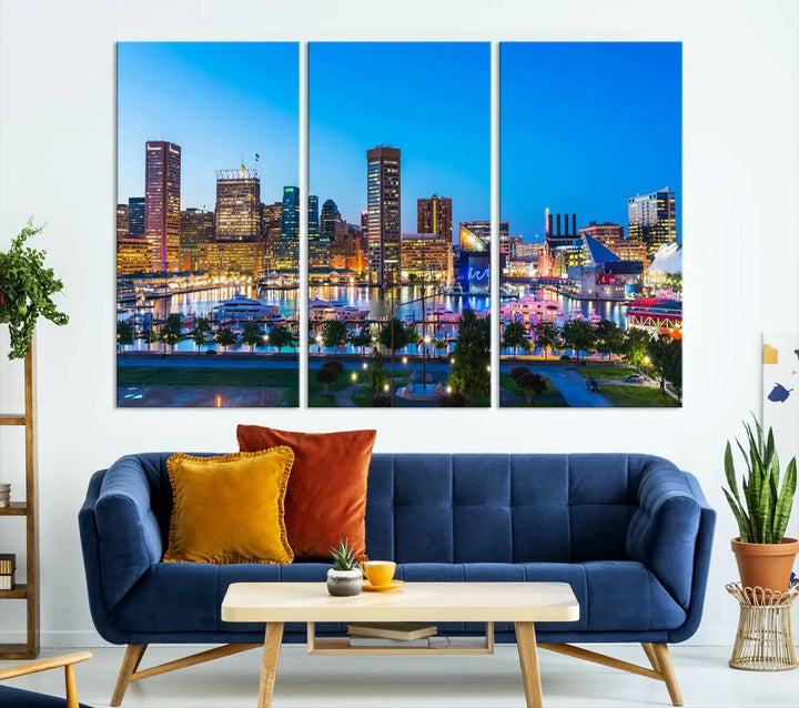 The Baltimore City Lights Blue Skyline Cityscape View Wall Art Canvas Print, a three-panel depiction of a city skyline at dusk on museum-quality canvas, adorns the area, showcasing an elegant evening cityscape.