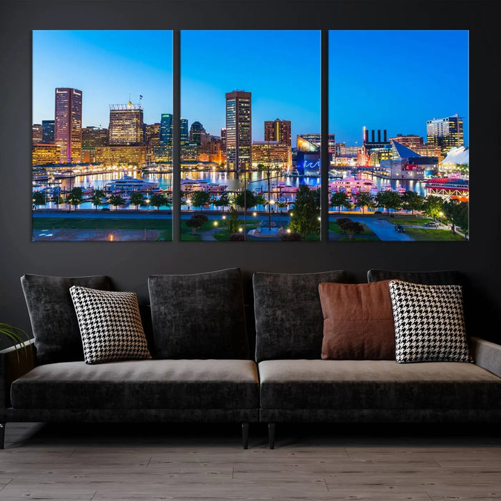 The Baltimore City Lights Blue Skyline Cityscape View Wall Art Canvas Print, a three-panel depiction of a city skyline at dusk on museum-quality canvas, adorns the area, showcasing an elegant evening cityscape.