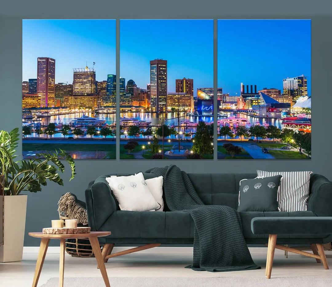 The Baltimore City Lights Blue Skyline Cityscape View Wall Art Canvas Print, a three-panel depiction of a city skyline at dusk on museum-quality canvas, adorns the area, showcasing an elegant evening cityscape.