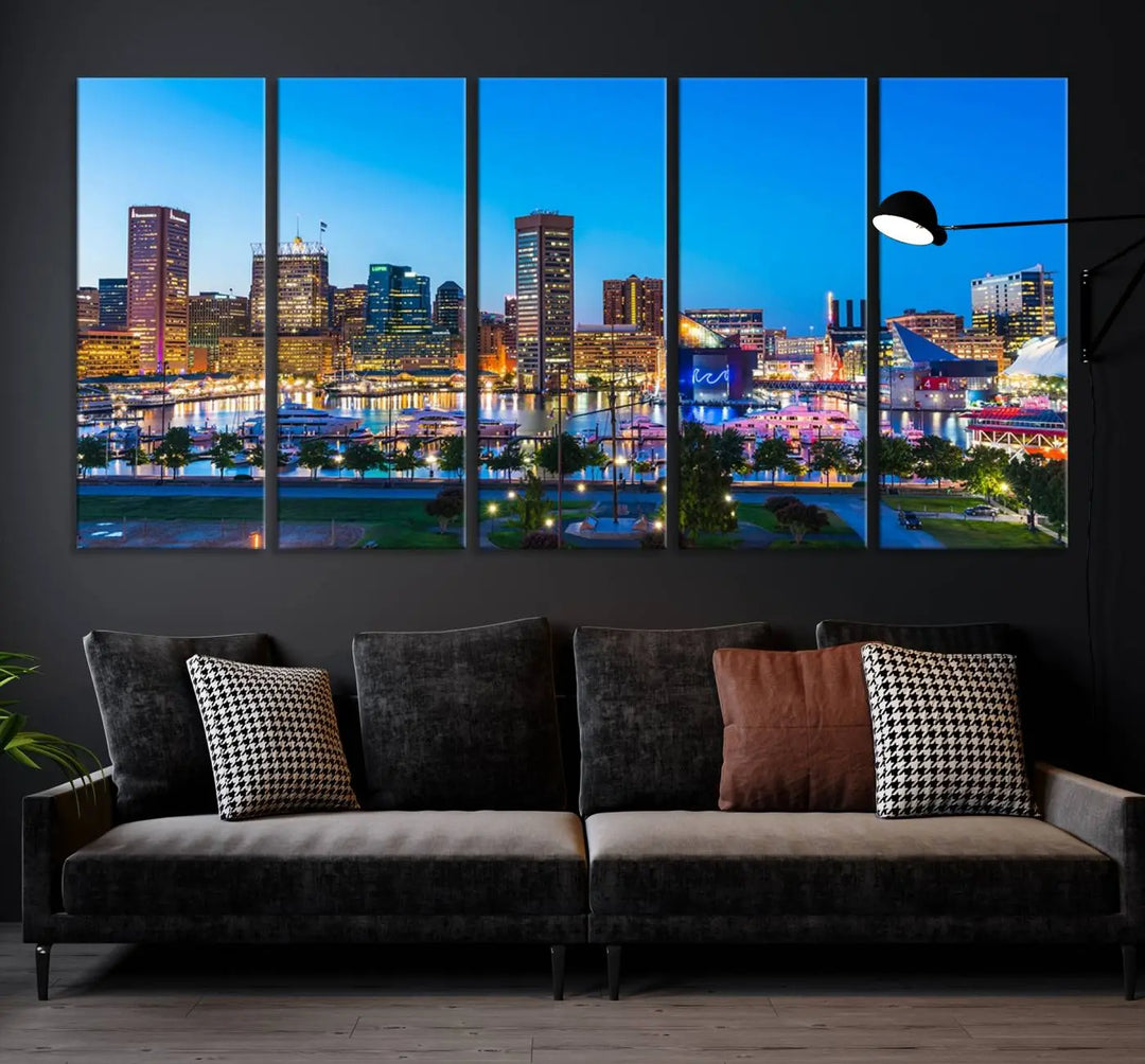 The Baltimore City Lights Blue Skyline Cityscape View Wall Art Canvas Print, a three-panel depiction of a city skyline at dusk on museum-quality canvas, adorns the area, showcasing an elegant evening cityscape.