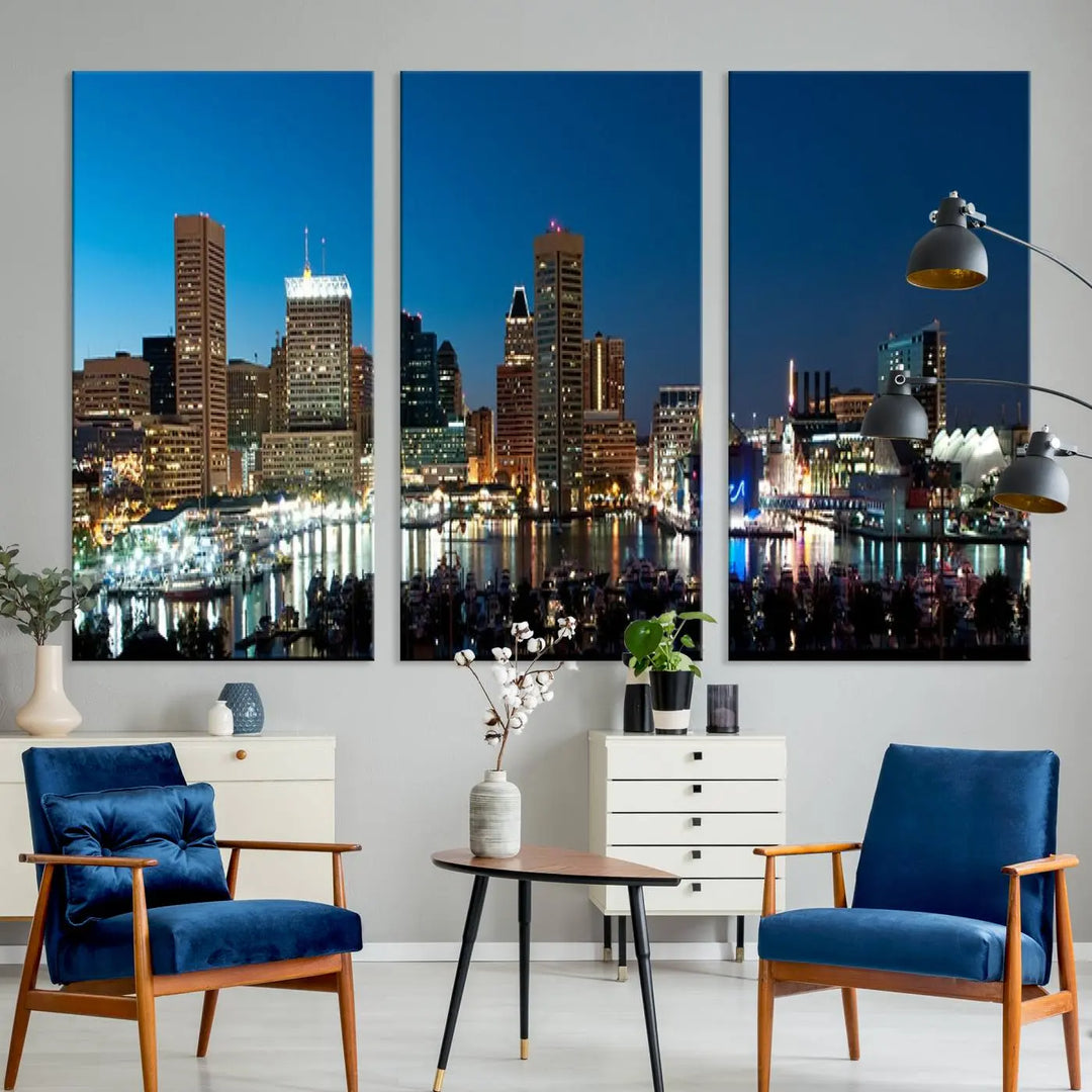 The Baltimore City Lights Night Blue Skyline Wall Art Canvas Print, professionally hand-assembled and ready to hang, graces the wall in this stylish living room.