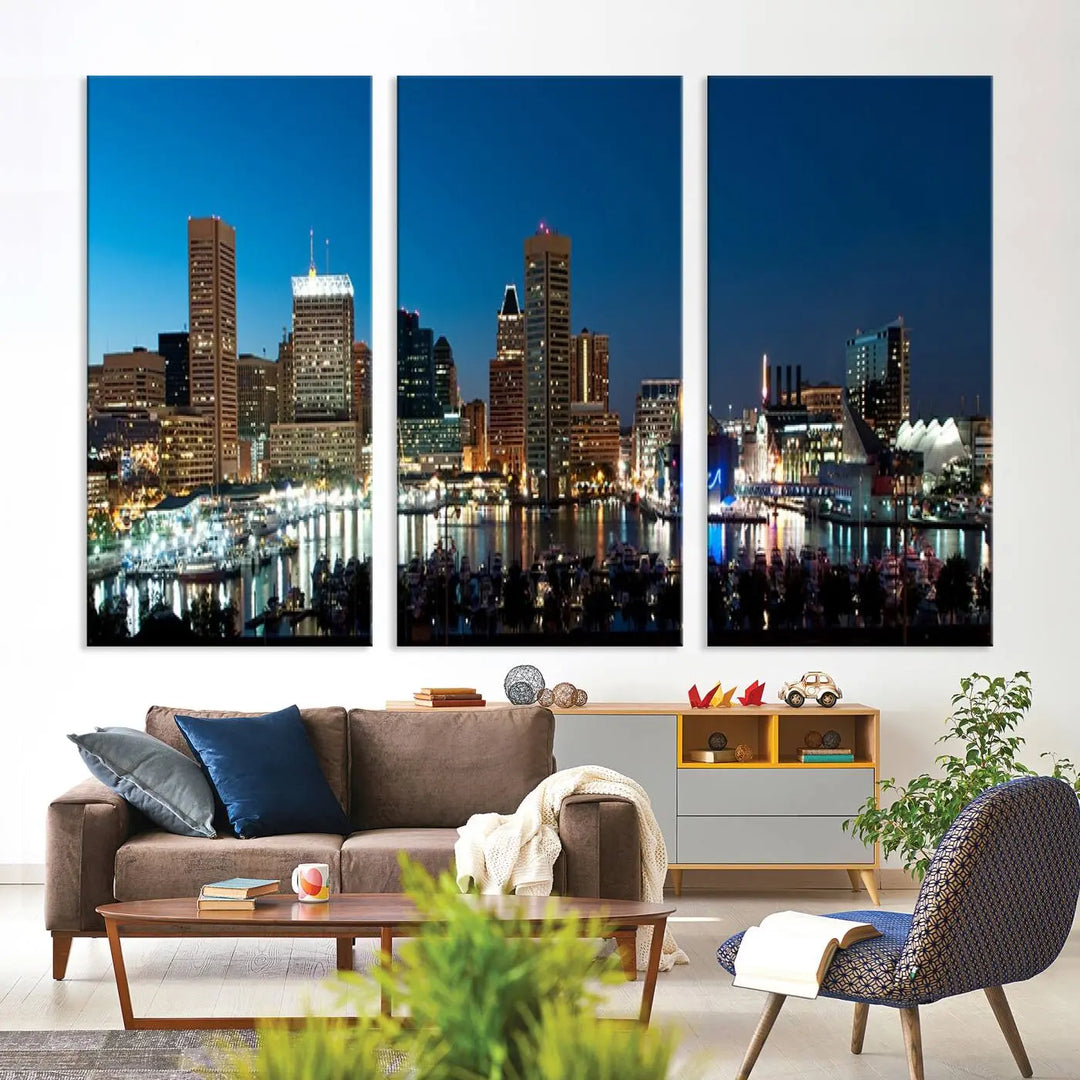 The Baltimore City Lights Night Blue Skyline Wall Art Canvas Print, professionally hand-assembled and ready to hang, graces the wall in this stylish living room.