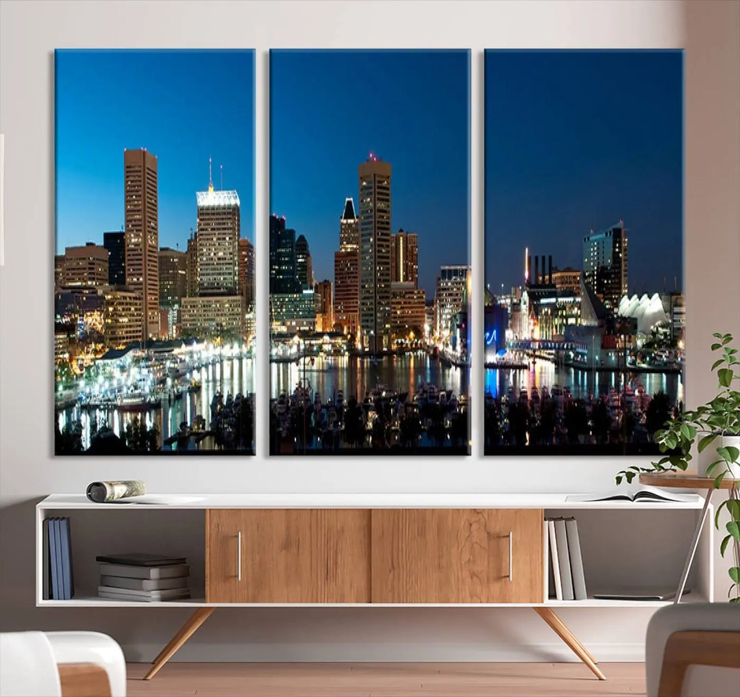 The Baltimore City Lights Night Blue Skyline Wall Art Canvas Print, professionally hand-assembled and ready to hang, graces the wall in this stylish living room.