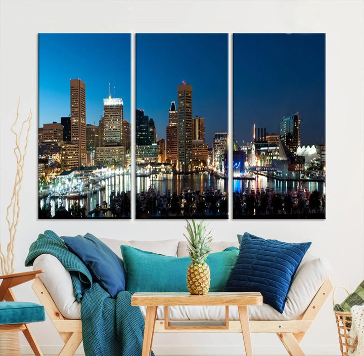 The Baltimore City Lights Night Blue Skyline Wall Art Canvas Print, professionally hand-assembled and ready to hang, graces the wall in this stylish living room.