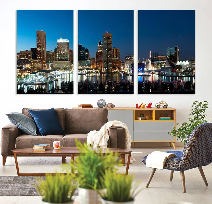 The Baltimore City Lights Night Blue Skyline Wall Art Canvas Print, professionally hand-assembled and ready to hang, graces the wall in this stylish living room.