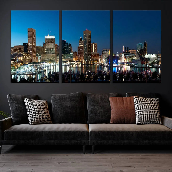 The Baltimore City Lights Night Blue Skyline Wall Art Canvas Print, professionally hand-assembled and ready to hang, graces the wall in this stylish living room.