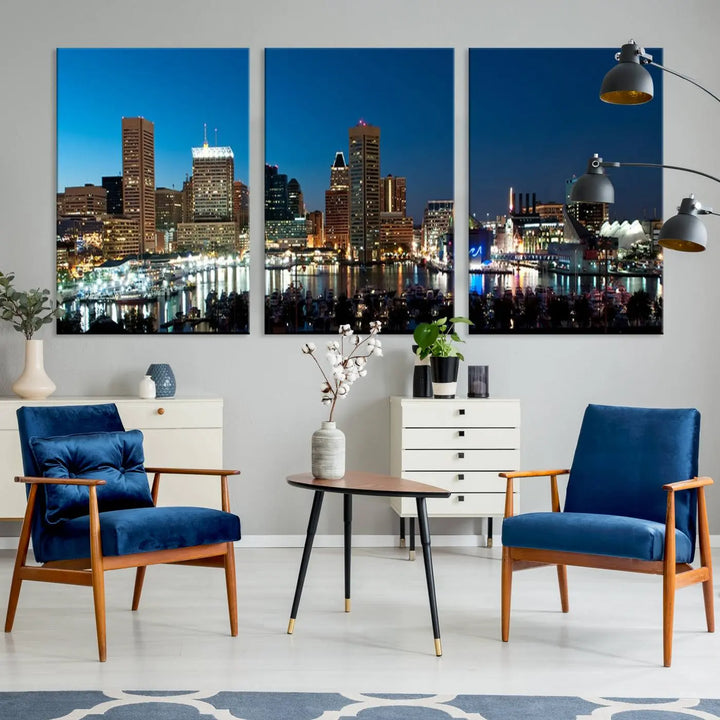 The Baltimore City Lights Night Blue Skyline Wall Art Canvas Print, professionally hand-assembled and ready to hang, graces the wall in this stylish living room.