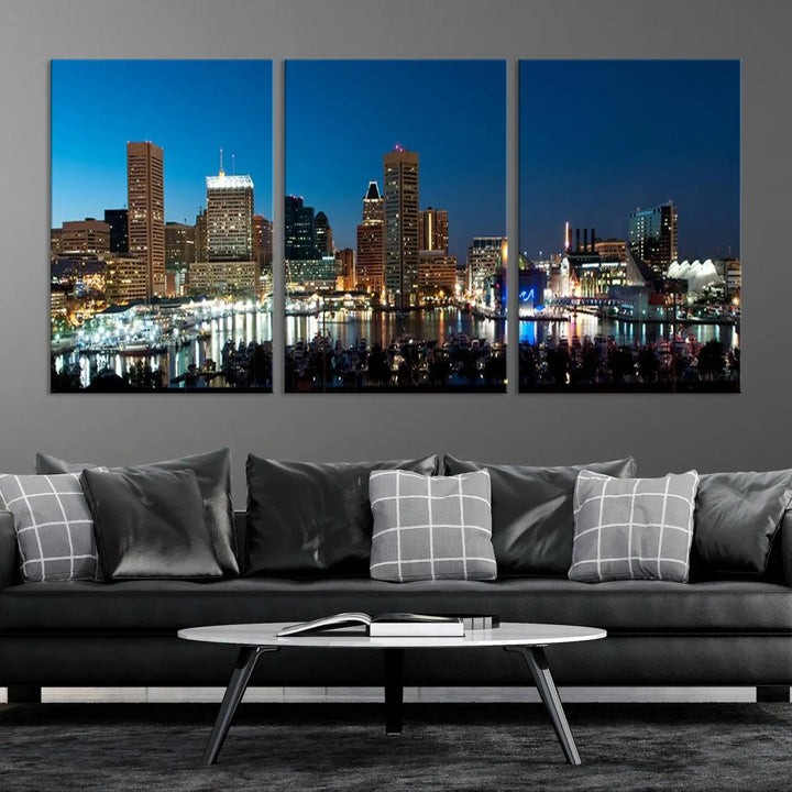 The Baltimore City Lights Night Blue Skyline Wall Art Canvas Print, professionally hand-assembled and ready to hang, graces the wall in this stylish living room.