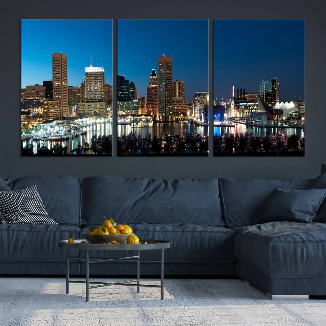 The Baltimore City Lights Night Blue Skyline Wall Art Canvas Print, professionally hand-assembled and ready to hang, graces the wall in this stylish living room.