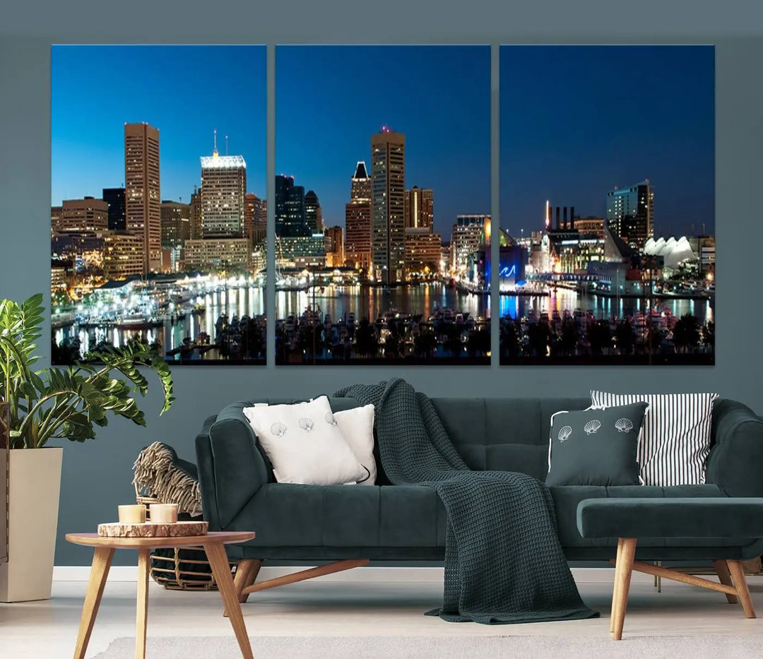 The Baltimore City Lights Night Blue Skyline Wall Art Canvas Print, professionally hand-assembled and ready to hang, graces the wall in this stylish living room.