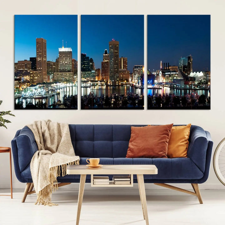 The Baltimore City Lights Night Blue Skyline Wall Art Canvas Print, professionally hand-assembled and ready to hang, graces the wall in this stylish living room.