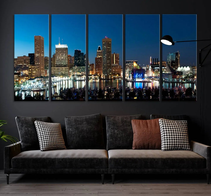 The Baltimore City Lights Night Blue Skyline Wall Art Canvas Print, professionally hand-assembled and ready to hang, graces the wall in this stylish living room.