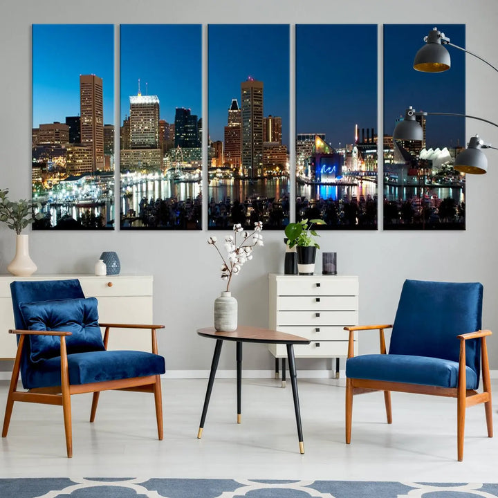 The Baltimore City Lights Night Blue Skyline Wall Art Canvas Print, professionally hand-assembled and ready to hang, graces the wall in this stylish living room.