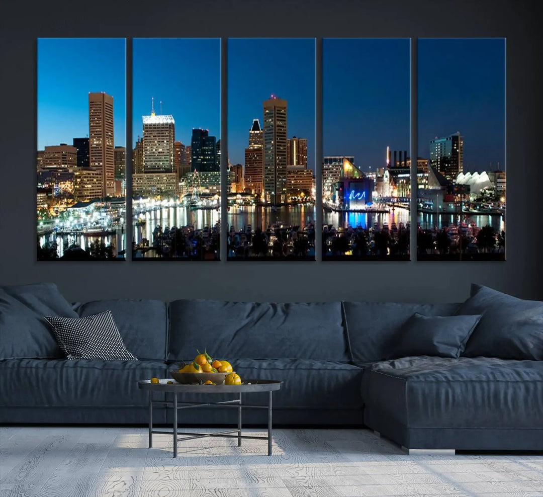 The Baltimore City Lights Night Blue Skyline Wall Art Canvas Print, professionally hand-assembled and ready to hang, graces the wall in this stylish living room.