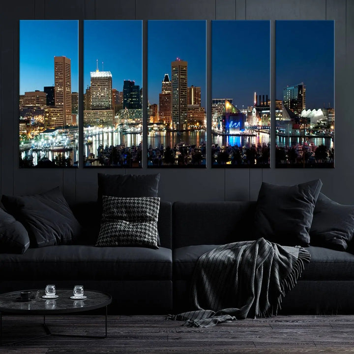 The Baltimore City Lights Night Blue Skyline Wall Art Canvas Print, professionally hand-assembled and ready to hang, graces the wall in this stylish living room.