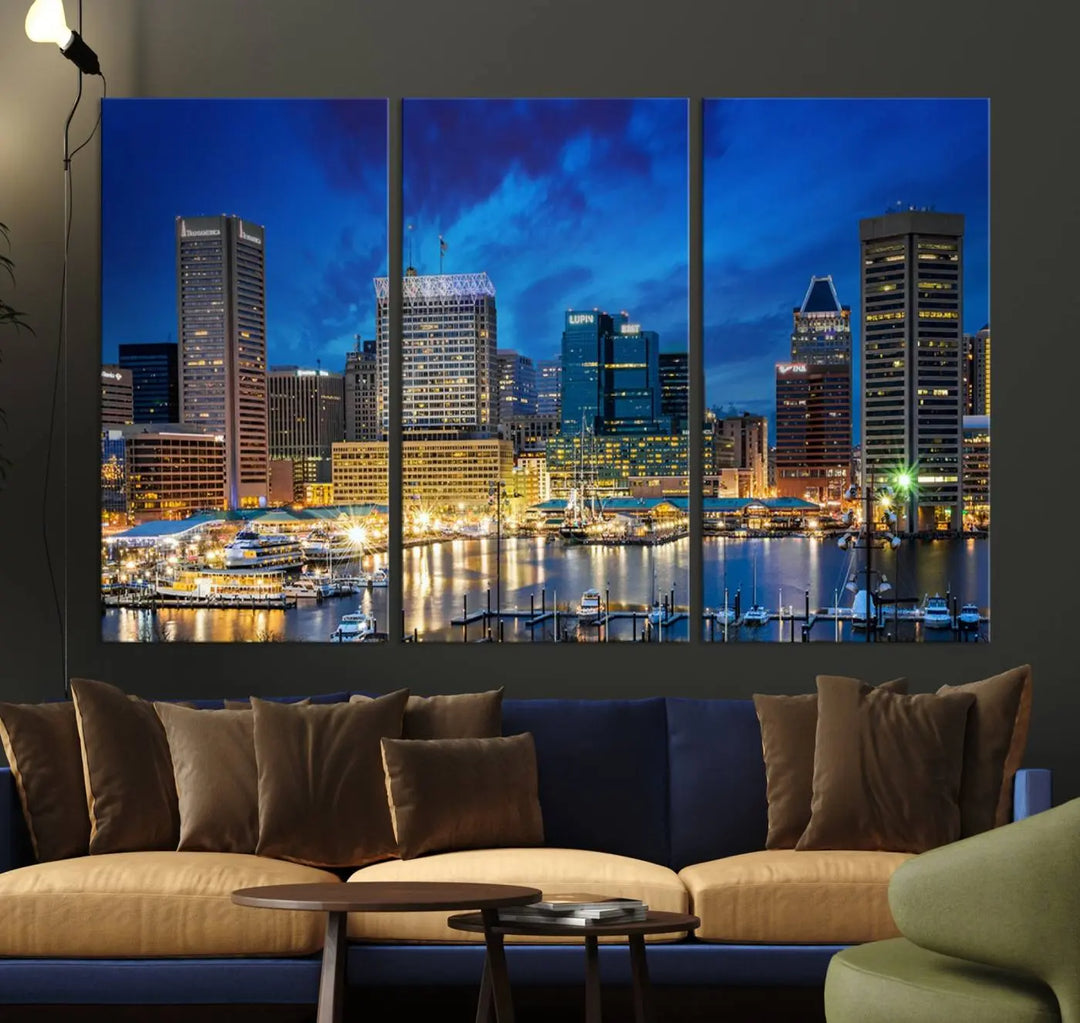 The living room features a nautical-themed triptych wall art on museum-quality canvas, showcasing the "Baltimore City Lights Night Cloudy Blue Skyline Cityscape View Wall Art Canvas Print.