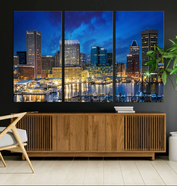 The living room features a nautical-themed triptych wall art on museum-quality canvas, showcasing the "Baltimore City Lights Night Cloudy Blue Skyline Cityscape View Wall Art Canvas Print.