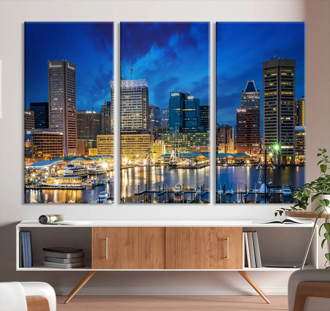 The living room features a nautical-themed triptych wall art on museum-quality canvas, showcasing the "Baltimore City Lights Night Cloudy Blue Skyline Cityscape View Wall Art Canvas Print.