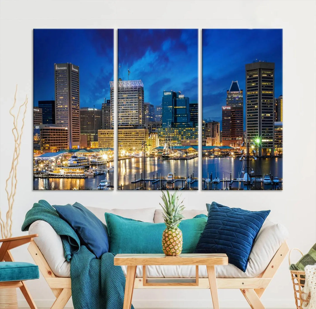 The living room features a nautical-themed triptych wall art on museum-quality canvas, showcasing the "Baltimore City Lights Night Cloudy Blue Skyline Cityscape View Wall Art Canvas Print.