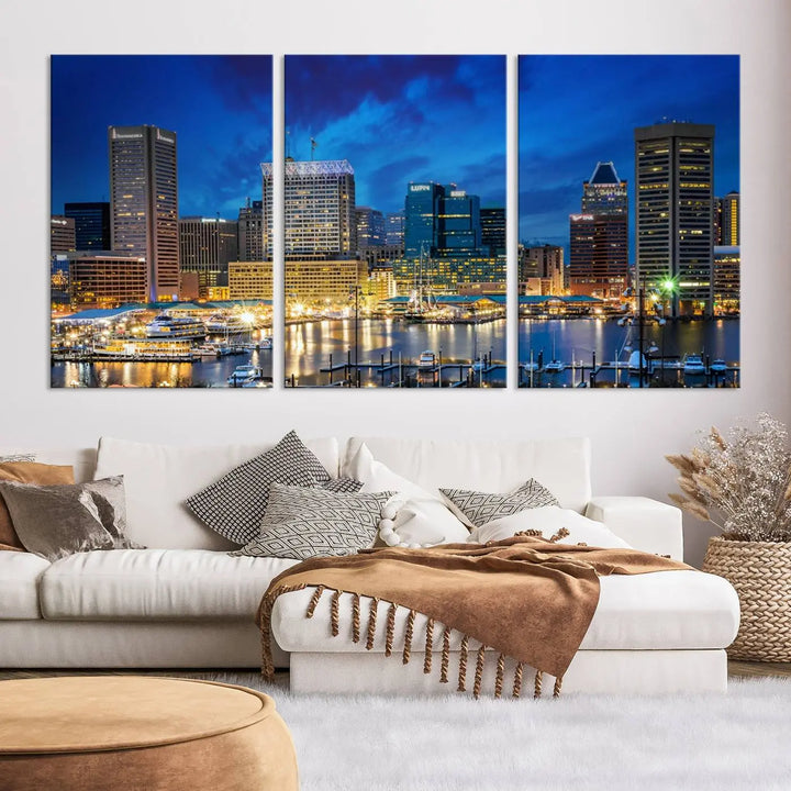 The living room features a nautical-themed triptych wall art on museum-quality canvas, showcasing the "Baltimore City Lights Night Cloudy Blue Skyline Cityscape View Wall Art Canvas Print.