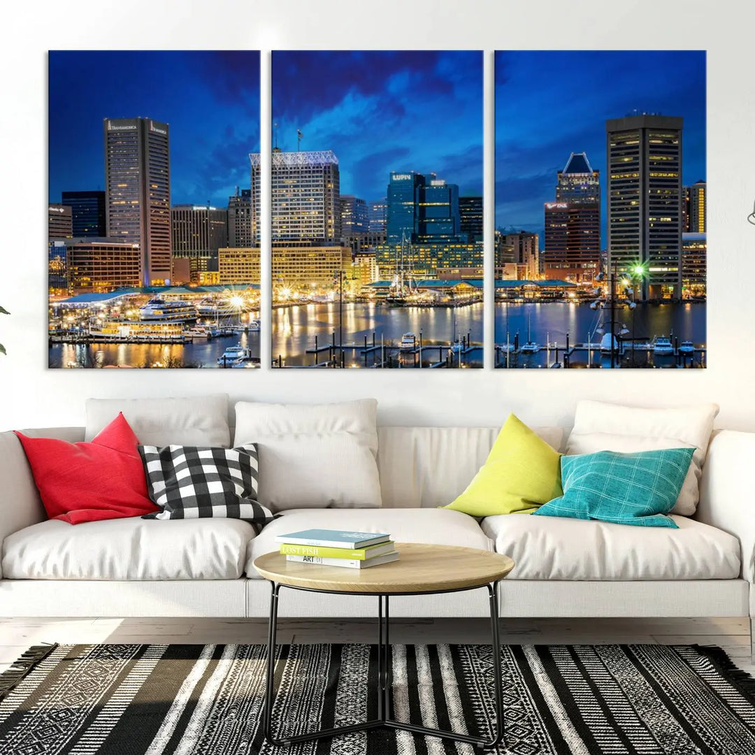 The living room features a nautical-themed triptych wall art on museum-quality canvas, showcasing the "Baltimore City Lights Night Cloudy Blue Skyline Cityscape View Wall Art Canvas Print.